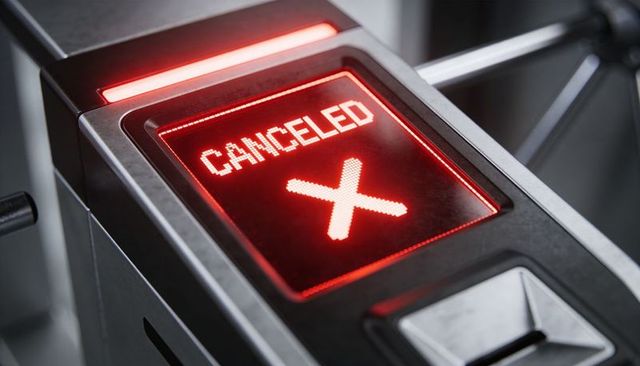 Red canceled signal on turnstile led display denying access at transit gate