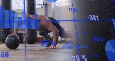 Shirtless man performing medicine ball push-up with blue fitness data and analytics overlay