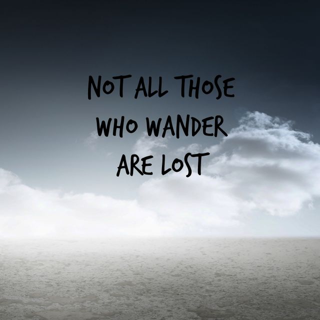 This image depicts an inspirational quote 'Not all those who wander are lost' overlaid on an arid landscape with a dramatic cloudy sky. It conveys a sense of adventure and introspection, suitable for use in travel blogs, motivational posters, social media posts, and lifestyle websites. Its striking contrast of barren land and a vibrant sky evokes a sense of wanderlust and exploration.