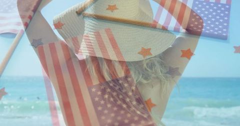 Woman at beach raising hat with american flag overlay