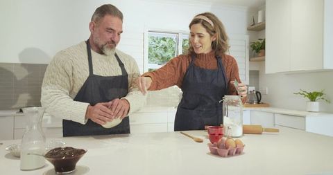 Couple Baking Together in Cozy Home Kitchen