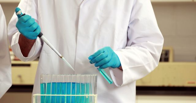 Scientist in Laboratory Conducting Experiment with Test Tubes - Download Free Stock Images Pikwizard.com