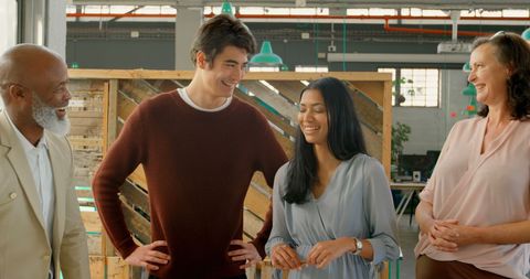 Diverse Professionals Sharing Camaraderie in Modern Office