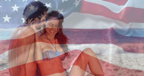 Romantic beach couple with american flag overlay