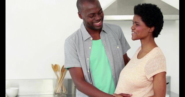 Happy African American Couple Expecting Baby in Kitchen - Download Free Stock Images Pikwizard.com