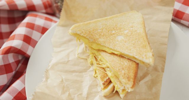 Image of slices of toasted cheese white bread sandwiches on paper and plate - Download Free Stock Photos Pikwizard.com