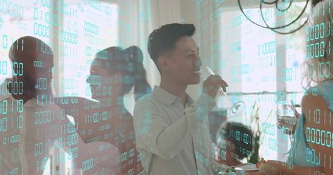 Young adults toasting at home gathering with teal binary overlay suggesting digital networking