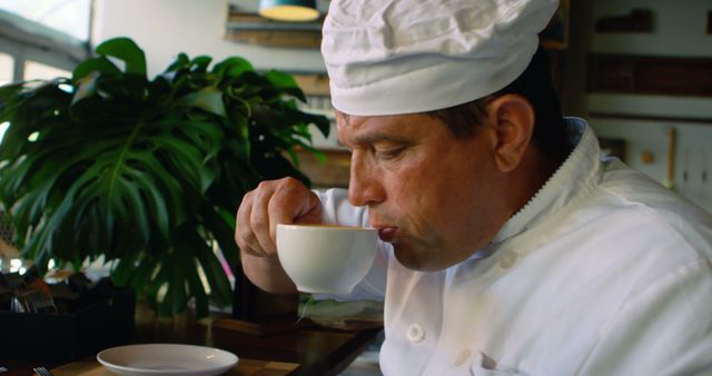 Professional Chef Enjoying Morning Beverage in Modern Cafe - Download Free Stock Images Pikwizard.com