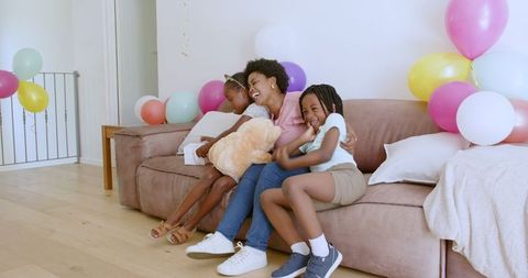 Joyful Family Birthday Celebration with Laughter and Affection