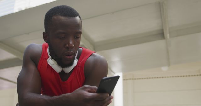 Man Checking Phone During Workout Break in Gym - Download Free Stock Images Pikwizard.com