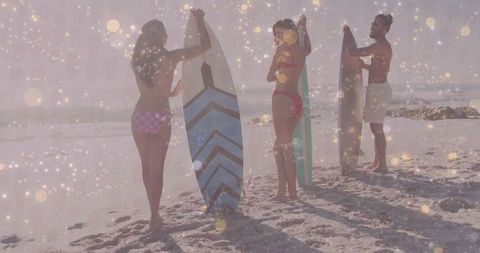Friends Holding Surfboards on Sunny Beach With Sparkles
