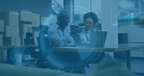 Corporate teamwork discussing laptop documents with hud data overlay in modern workspace