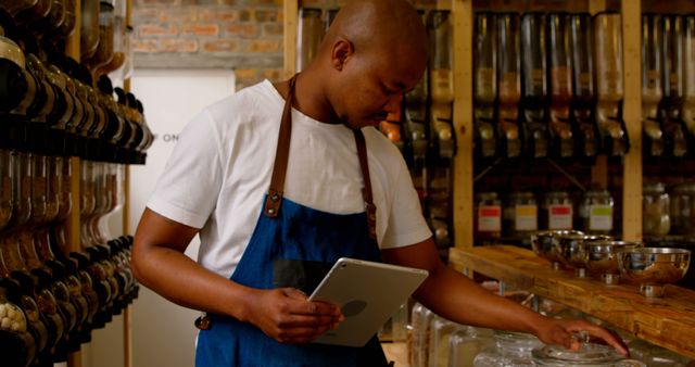 Grocery Store Worker Managing Inventory with Digital Tablet - Download Free Stock Images Pikwizard.com