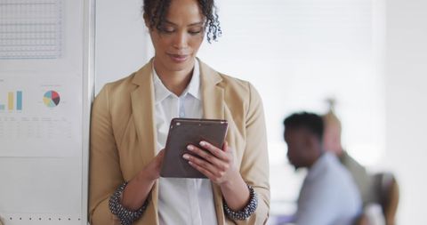 Professional Woman Using Tablet in Modern Office Setting - Download Free Stock Images Pikwizard.com