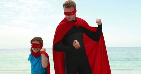 Father and Son as Superheroes Flexing on Beach