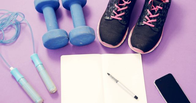 Fitness Equipment with Shoes and Notebook on Purple Background - Download Free Stock Images Pikwizard.com