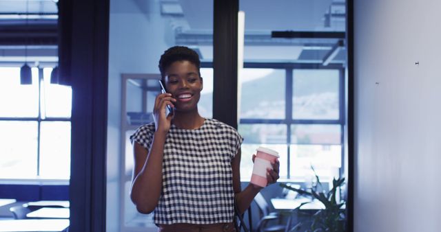 Businesswoman Talking On Phone With Coffee In Hand - Download Free Stock Images Pikwizard.com