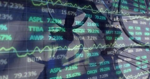 Reflected trader monitoring stock tickers and market charts with double exposure dataviz
