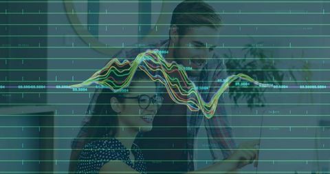 Team Collaborating on Data Dashboard with Laptop and Colorful Analytics Overlay in Office
