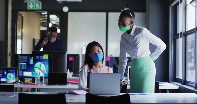 Colleagues Collaborating with Masks in Modern Office Environment - Download Free Stock Images Pikwizard.com