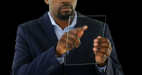 Businessman Engaging with Transparent Glass Screen on Black Background