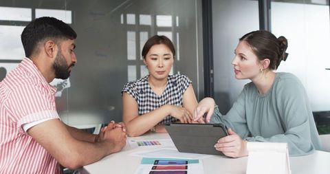 Team Collaborating on App Design with Guidance from Senior Leader