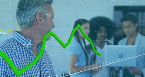 Mixed Heritage Business Team Analyzing Financial Data