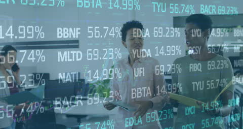 Businesswomen Discussing Data Analytics in Modern Office Environment