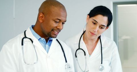 Two Doctors Examining Medical Records in Hospital Setting - Download Free Stock Images Pikwizard.com