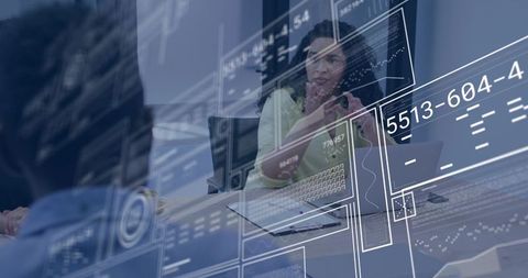 Female executive leading team meeting with futuristic HUD data overlays and laptop