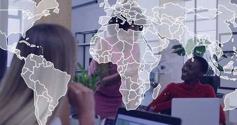 Global teamwork with smiling woman in red knit top collaborating at modern office