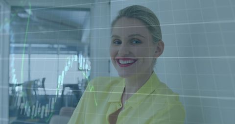 Smiling Businesswoman Analyzing Financial Graph in Modern Office