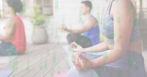 Digital mindfulness: woman meditating on outdoor deck with binary code overlay