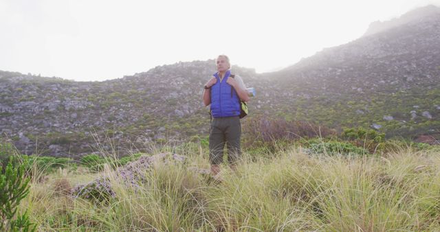 Man Hiking in Rugged Mountains in Early Morning Light - Download Free Stock Images Pikwizard.com