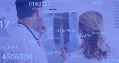Doctors Analyzing X-Ray with Data Overlays in Digital Interface