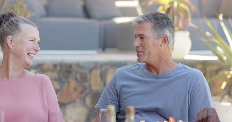 Senior Couple Engaging in Leisurely Outdoor Conversation