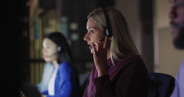 Diverse Business Team Working Late at Night Using Headsets - Download Free Stock Images Pikwizard.com