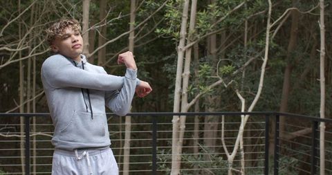 Man Stretching in Nature for Wellness and Vitality Outdoors
