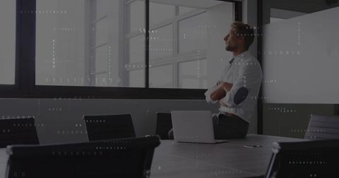 Businessman Analyzing Data in Modern Conference Room