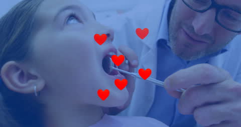 Caring Pediatric Dentist Examining Young Patient with Heart Icons
