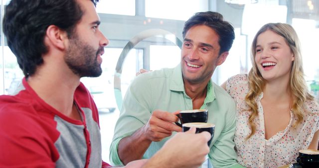 Friends Enjoying Coffee in a Cozy Cafe - Download Free Stock Images Pikwizard.com