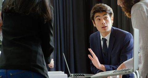 Businessman actively participating in team meeting