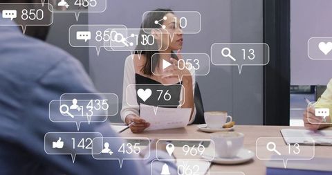 Businesswoman leading meeting with social media metrics overlay for team strategy