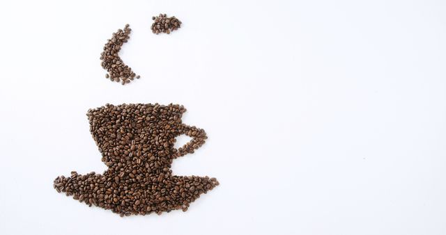 Coffee beans are arranged creatively to depict a steaming cup, with copy space. This artistic presentation emphasizes the love for coffee and its importance in daily life.