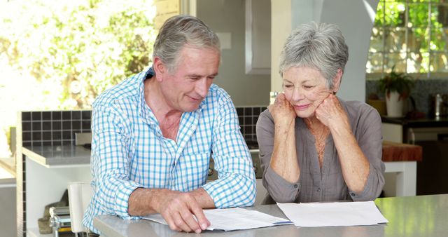 Senior couple counting bills together