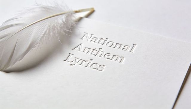 Embossed National Anthem Lyrics with White Feather Minimal High-Key Stationery Concept