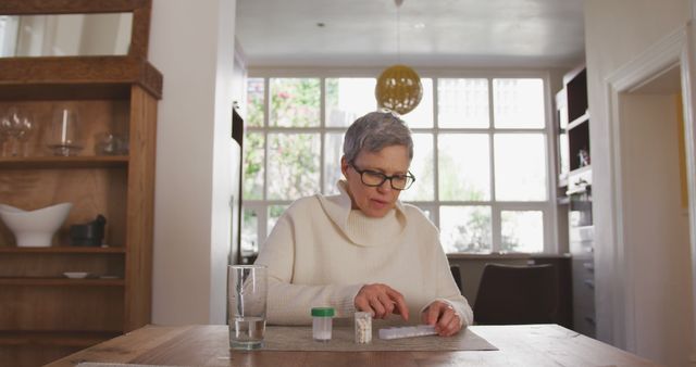 Senior Woman Taking Medication at Home - Download Free Stock Images Pikwizard.com