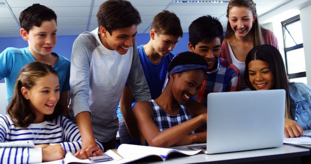 Diverse Group of Students Collaborating on Laptop in Classroom - Download Free Stock Images Pikwizard.com