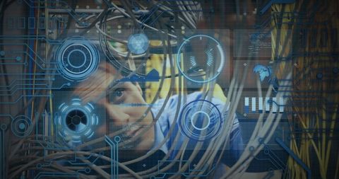 Technician examining network wires with digital overlay