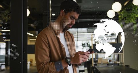 Modern Businessman Engaged with Smartphone in Office Environment
